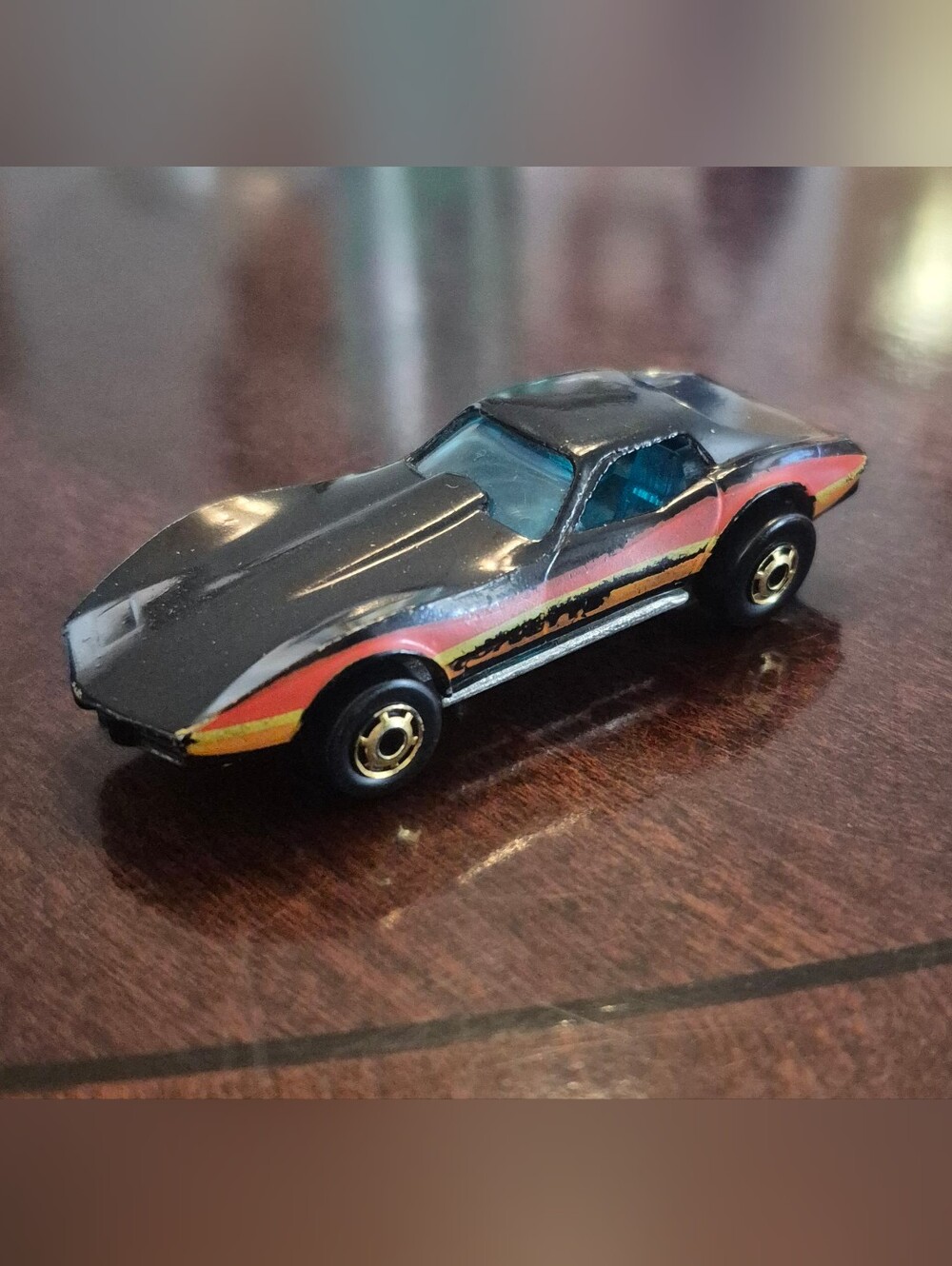 Hot Wheels Chevrolet Corvette Stingray 1975 Diecast Car Black Orange Stripe